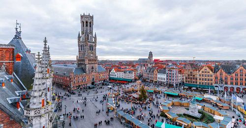 Take photos of the traditional Belgium architecture surrounding the Bruges Market Square