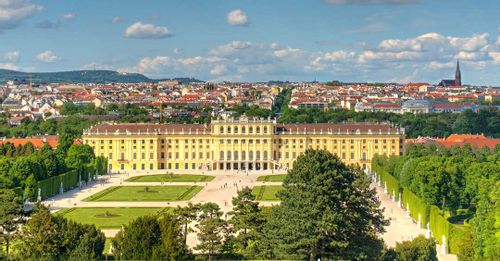 Admire the elaborate garden design at the Schönbrunn Palace while standing at the Gloriette monument