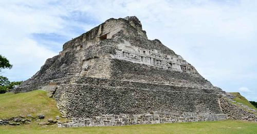 Climb to the top of El Castillo at Xunantunich for panoramic views and Guatemala in the distance